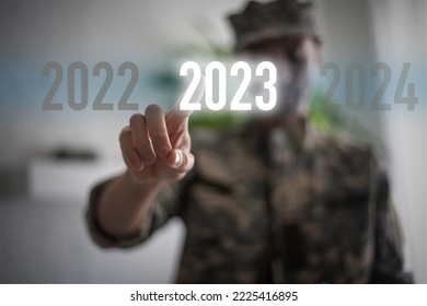 Stop the War concept. Text and hand virtual numbers 2023, military - Shutterstock ID 2225416895