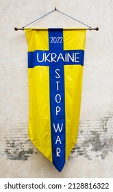 Stop War In Ukraine Written On A Flag With Colors Of The Republic Of Ukraine. Third World War Concept