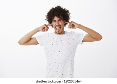 Stop Yelling At Me, Not Gonna Listen Anymore. Portrait Of Pissed And Annoyed Good-looking Man With Dark Skin And Afro Hairstyle, Closing Ears And Telling Shut Up, Being Bothered With Noise