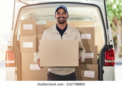 Stopping Off For Another Delivery. Portrait Of A Delivery Man Unloading Boxes From His Van.