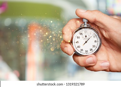 Stopwatch in Human Hand - Shutterstock ID 1319321789