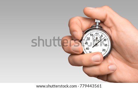 Stopwatch in Human Hand