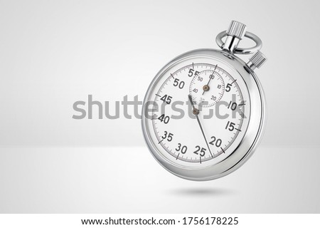 Stopwatch on gray background. Classic mechanical style, metallic chrome color.  