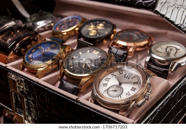 storage black leather box with collection of men\
wrist watches