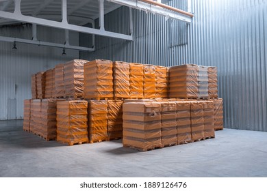 The Storage And Carriage At Industrial Food Industry Facility. A Glass Clear Bottles For Alcoholic Or Soft Drinks Beverages And Canning Jars Stacked On Pallets For Forklift.