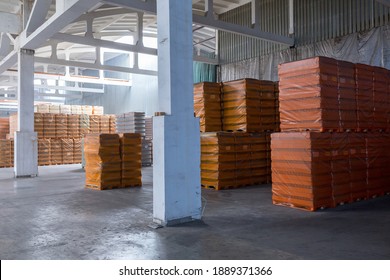 The Storage And Carriage At Industrial Food Industry Facility. A Glass Clear Bottles For Alcoholic Or Soft Drinks Beverages And Canning Jars Stacked On Pallets For Forklift.