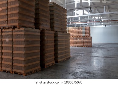 The Storage And Carriage At Industrial Food Industry Facility. A Glass Clear Bottles For Alcoholic Or Soft Drinks Beverages And Canning Jars Stacked On Pallets For Forklift.