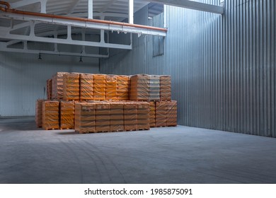 The Storage And Carriage At Industrial Food Industry Facility. A Glass Clear Bottles For Alcoholic Or Soft Drinks Beverages And Canning Jars Stacked On Pallets For Forklift.