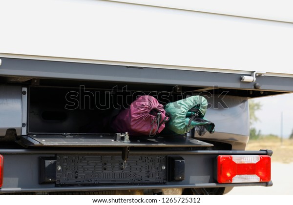storage compartment behind the truck and travel\
goods inside