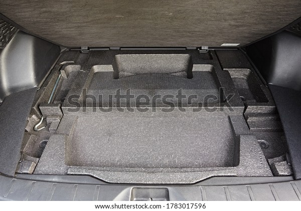 Storage\
compartments under the boot floor in the\
car