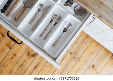 Storage Concept Or Cutlery Drawer With Silver Ware, Spoon, Fork, Knife And Utensils At Modern Home Kitchen, Top View