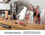 Storage of cosmetics on dressing tabl.Cosmetic box on the dresser. Set of body care cosmetic products. Decorative and care product. Cosmetic bag. Storage box. Beauty concept. Makeup. Space for text.