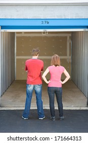 Storage: Couple Looking at Empty Unit
