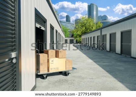 Storage facility, Self storage. Cart with packed boxes stands outside rental units for moving, delivery and temporary storage.
