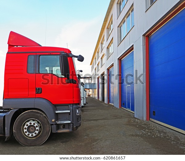 Storage and freight\
terminal. Industrial background. Terminal for truck loading with\
closed gates.\
Logistics.