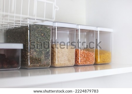 Storage ideas in the kitchen. White box and basket. Shelf order system. Modern interior. 