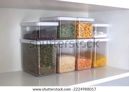 Storage ideas in the kitchen. White box and basket. Shelf order system. Modern interior. 