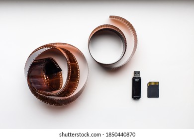 storage memory cards development concept and old 35mm film on the background