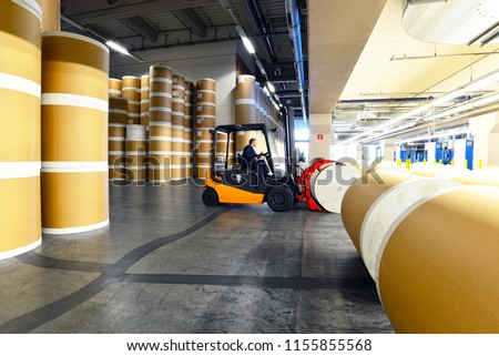 Storage of paper rolls in a large print shop