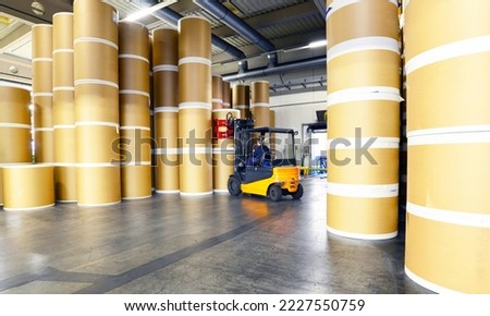Storage of paper rolls in a large print shop