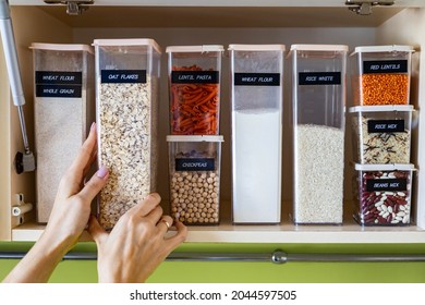 Storage Pasta In Pp Boxes Use Konmari Method At Wooden Cupboard In Kitchen. Placing, Sorting, Keeping Products Into Plastic Cases With Names Title At Nordic Style Cuisine. General Cleaning, Tidying Up