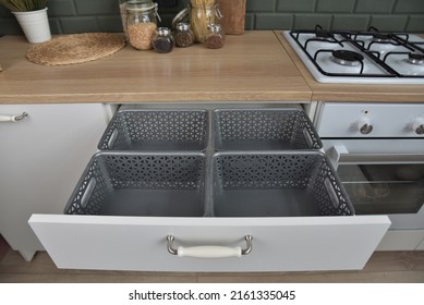 Storage System In Kitchen Drawers. Plastic Boxes For Storing Various Items.