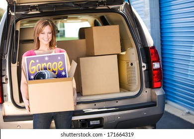 Storage: Woman Carrying Leftovers From Garage Sale