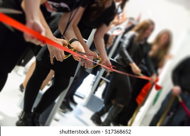 store grand opening - cutting red ribbon