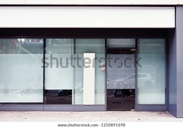 Store office\
entrance with empty advertising banner outdoor above door and\
window, space for design\
layout.