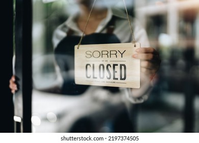 Store Owner Turning Close Sign Broad Through The Door Glass. Small Business Owner Concept.