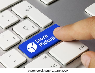 Store Pickup Written On Blue Key Of Metallic Keyboard. Finger Pressing Key.