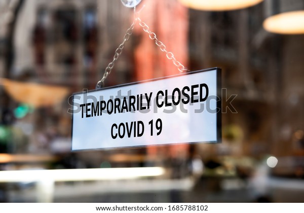 Store sign, temporarily closed. Coronavirus sign\
in a store.