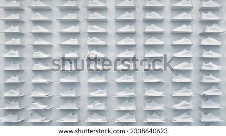 Store wall with large group of white sneakers