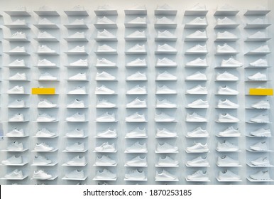 Store Wall With White Sneakers.