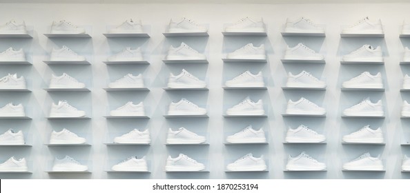 Store Wall With White Sneakers.