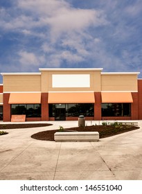 Storefront With Awning Ready For New Tenant At A Mixed Use Retail Strip Mall - Vertical