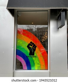 A Storefront Window In Harlem, New York, Painted With A BLM Pride Sign