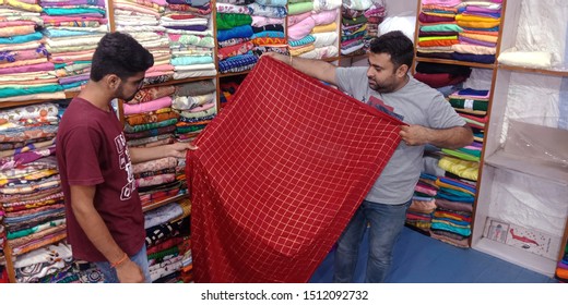 Storekeeper Showing Sari To The Male Customer At Wholesale Store District Katni Madhya Pradesh In India Shot Captured On Sep 2019