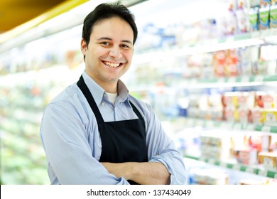 Storekeeper Smiling In His Grocery Store 