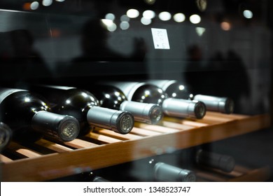 Storing bottles of wine in fridge. Alcoholic card in restaurant. Cooling and preserving wine. - Shutterstock ID 1348523747