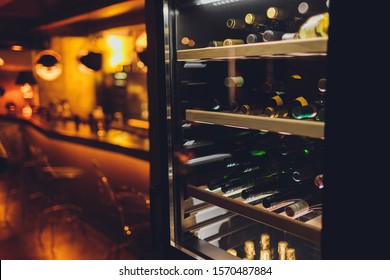 Storing Bottles Of Wine In Fridge. Alcoholic Card In Restaurant. Cooling And Preserving Wine.