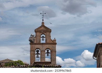 Storks nesting on the Bell Tower of the Convent of Santa Carla in Tordesillas. - Powered by Shutterstock