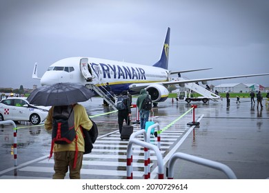 Storm At The Airport. View Of The Airplane Through Rain Drops. Themes Weather And Delay Or Canceled Flight. ORIO AL SERIO, BERGAMO, ITALY - November 2021