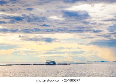 A Storm Approaching A Fish Farm On Lake Kariba.  Sun Peaking Through.  Zimbabwe, Africa.