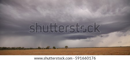 A storm cloud over the desert outback of western Queensland.