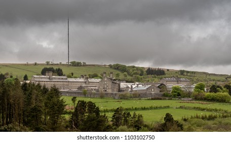 Storm Clouds Above The Granite Walls And Buildings Of HM Prison Dartmoor