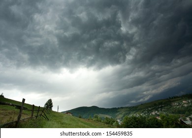 Storm clouds above a mountain village