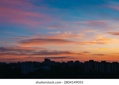 Storm clouds build ominously, casting shadows over the city skyline. Vibrant hues of purple and orange fill the sky as thunder looms in the distance, signaling an impending storm.