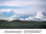 Storm Clouds Build Over The Rolling Hills Of Hayden Valley in Yellowstone