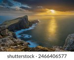 Storm clouds coming to Neist Point near Glendale on the West Coast of the Isle of Skye on Scotland during sunset